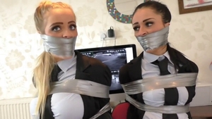 Busty employee goes in for submissive bondage in office